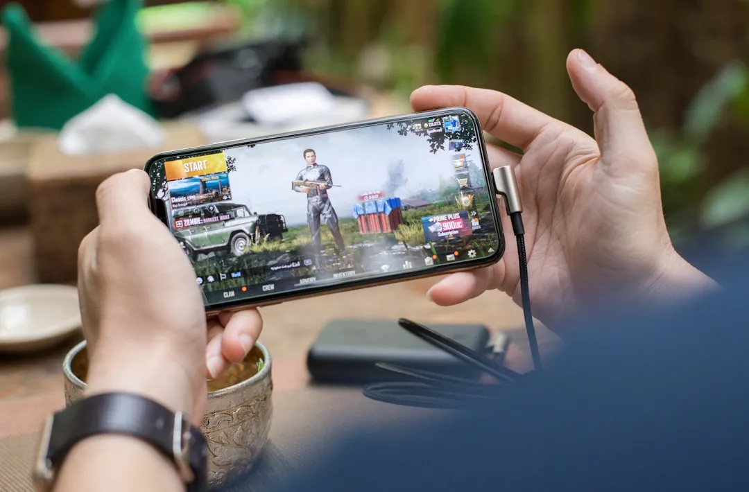 PUBG Mobile game start screen displayed on a smartphone, photo by I'M ZION on Unsplash